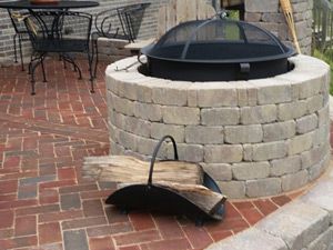 Raised patio with firepit and pillars